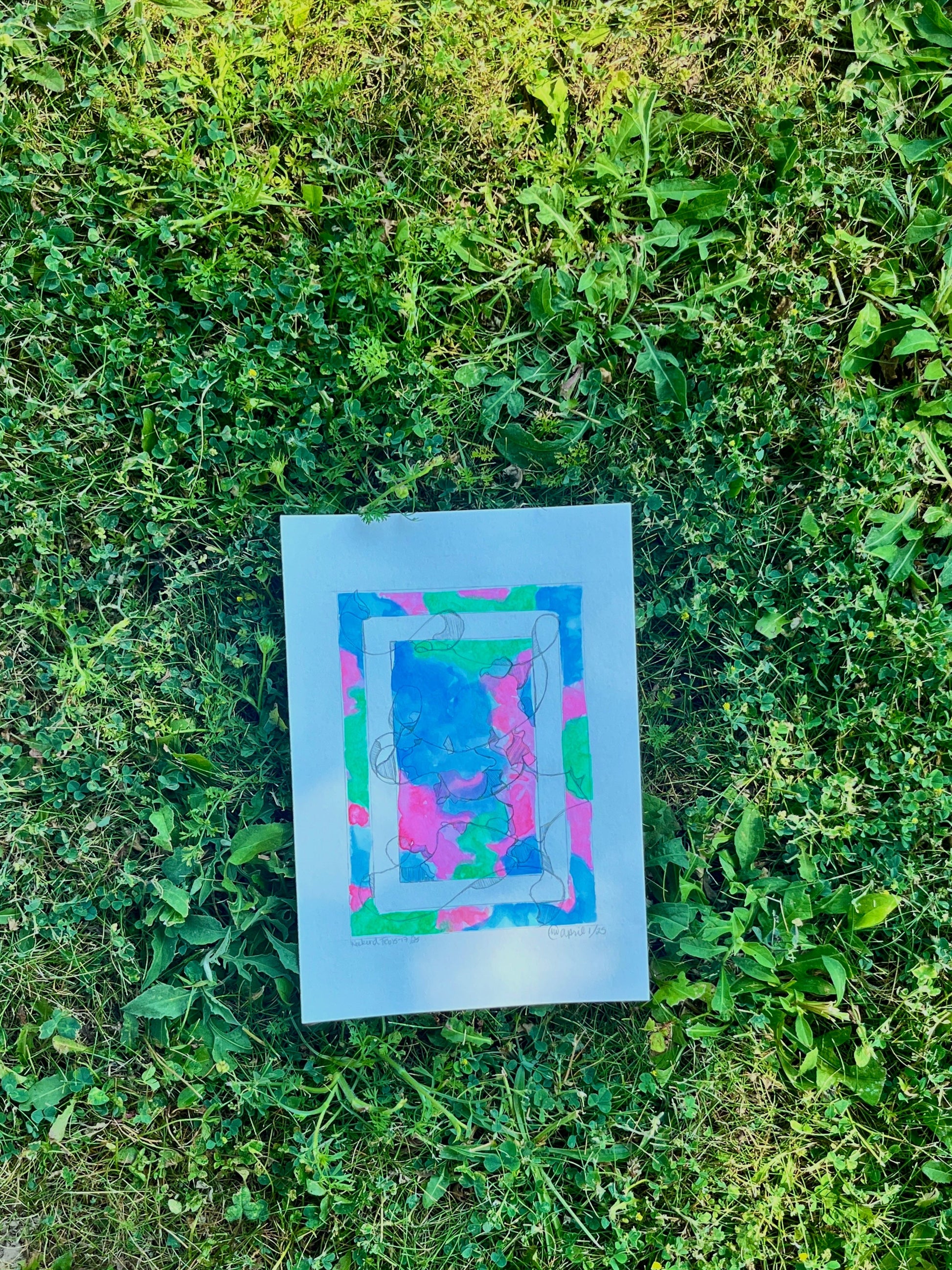Colourful abstract painting in the grass