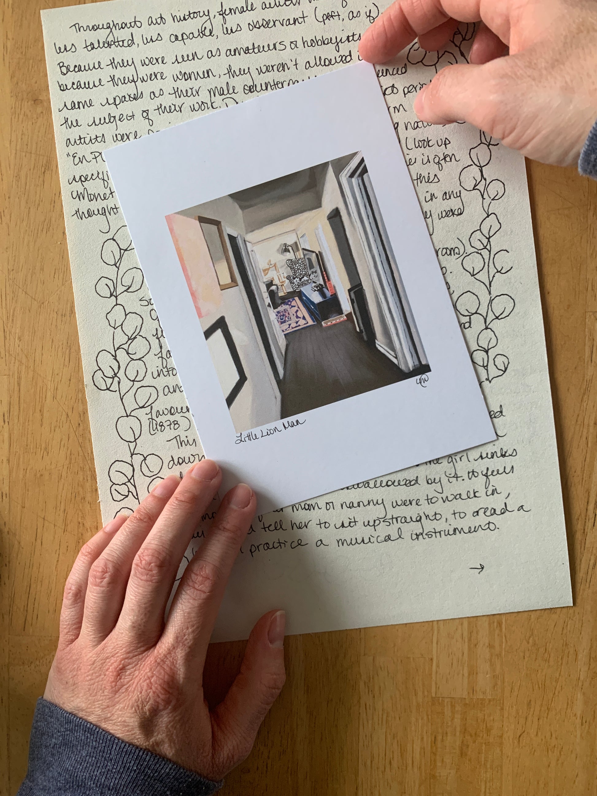 Pet portrait on top of snail mail letter. Held by artist
