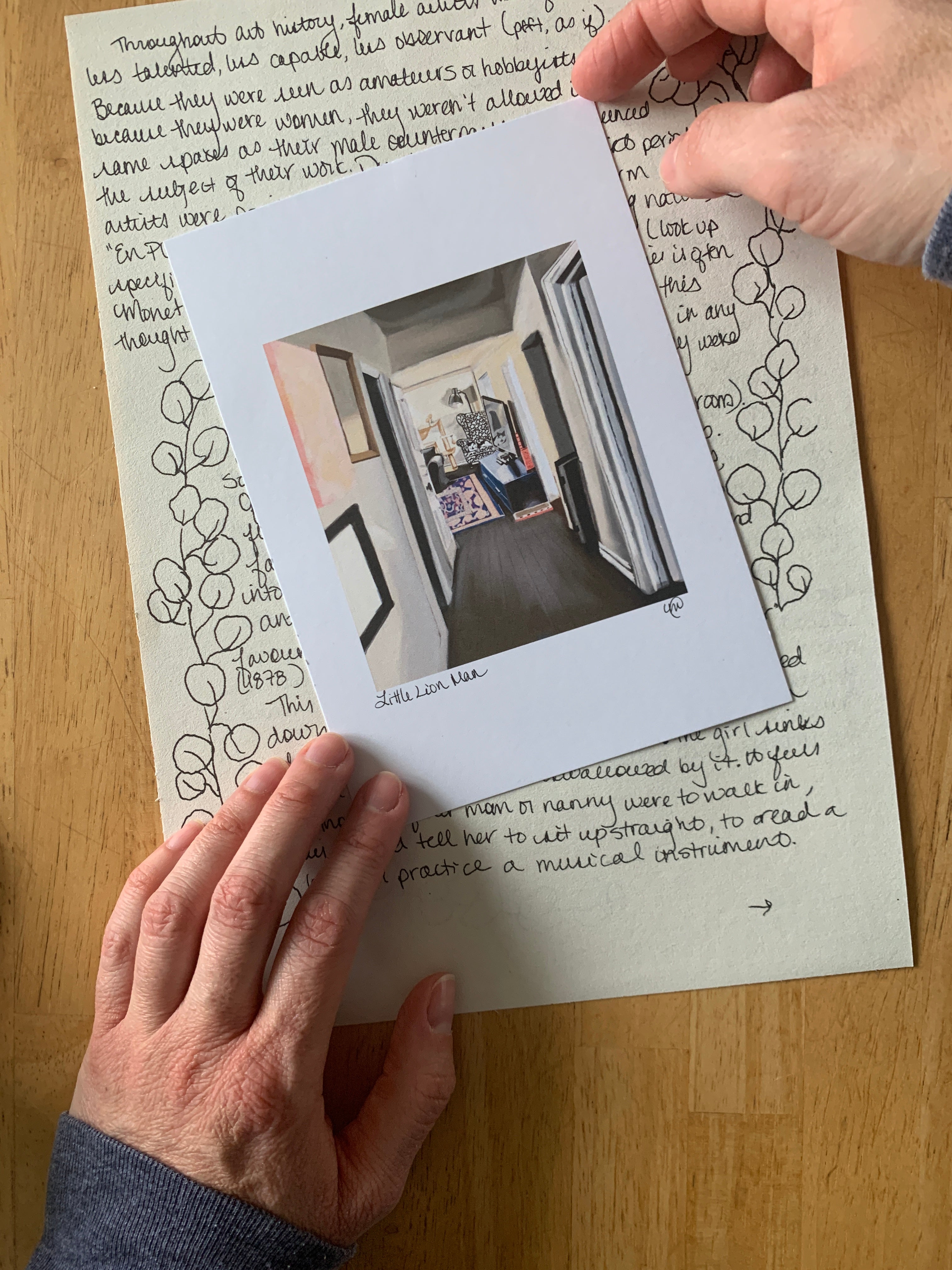 Pet portrait on top of snail mail letter. Held by artist